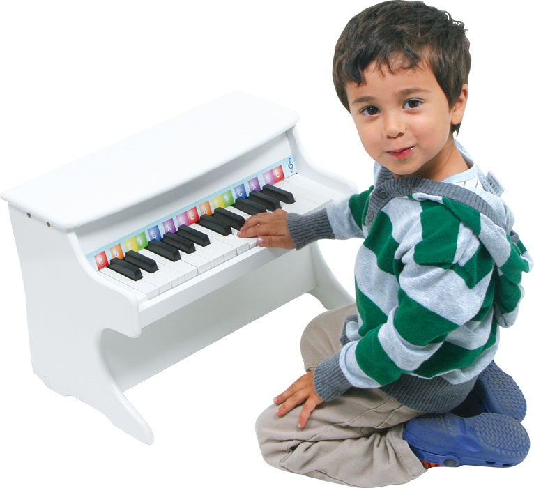 Véritable piano blanc en bois, à la taille de vos bambins pour aiguiser son sens du rythme et apprendre la musique!! Legler