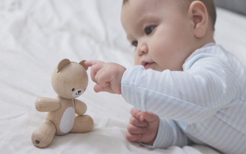 Ourson articulé en bois, plan toys, à partir de 1 ans.